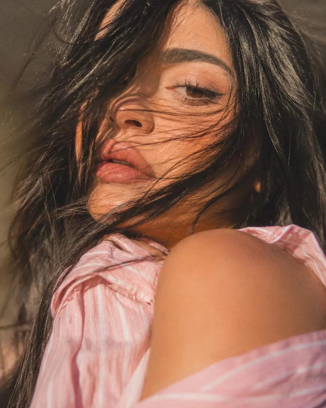 Cinematic Extreme Close-Up Portrait with Chaotic Hair and Pink Striped Shirt - Image prompt preview