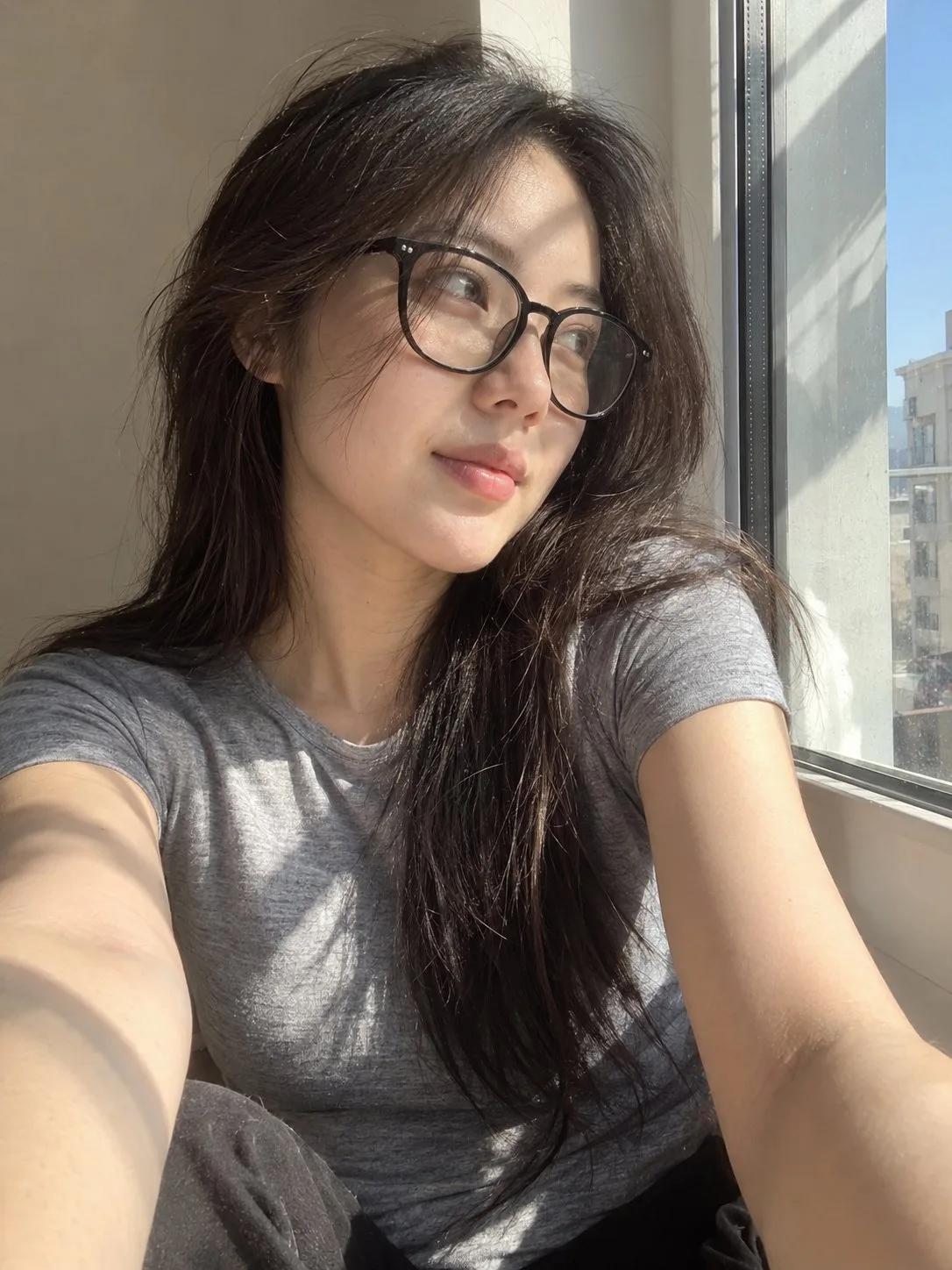 Photorealistic Smartphone Selfie of a Young Woman by a Sunlit Window - Image prompt preview