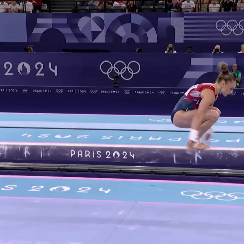 photorealistic shot of the women's beam final at the olympics. gymnast fr...