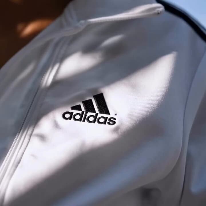 Ultra-realistic commercial fashion video of a beautiful young woman weari...