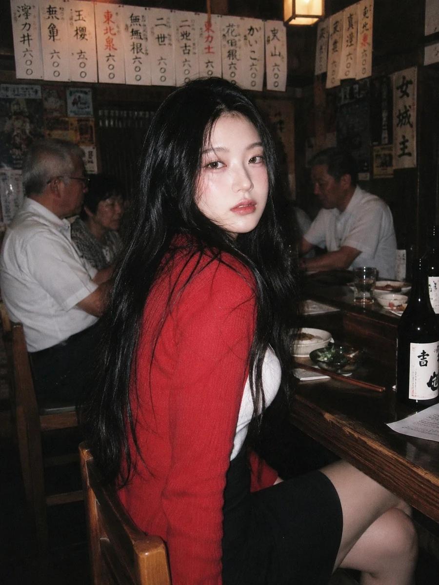 A 90s disposable-camera style flash snapshot taken inside a small, bustli...