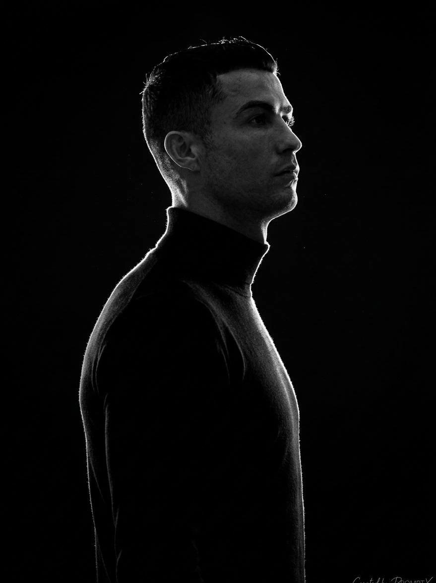A stark, high-contrast, black-and-white (monochromatic) side-profile port...