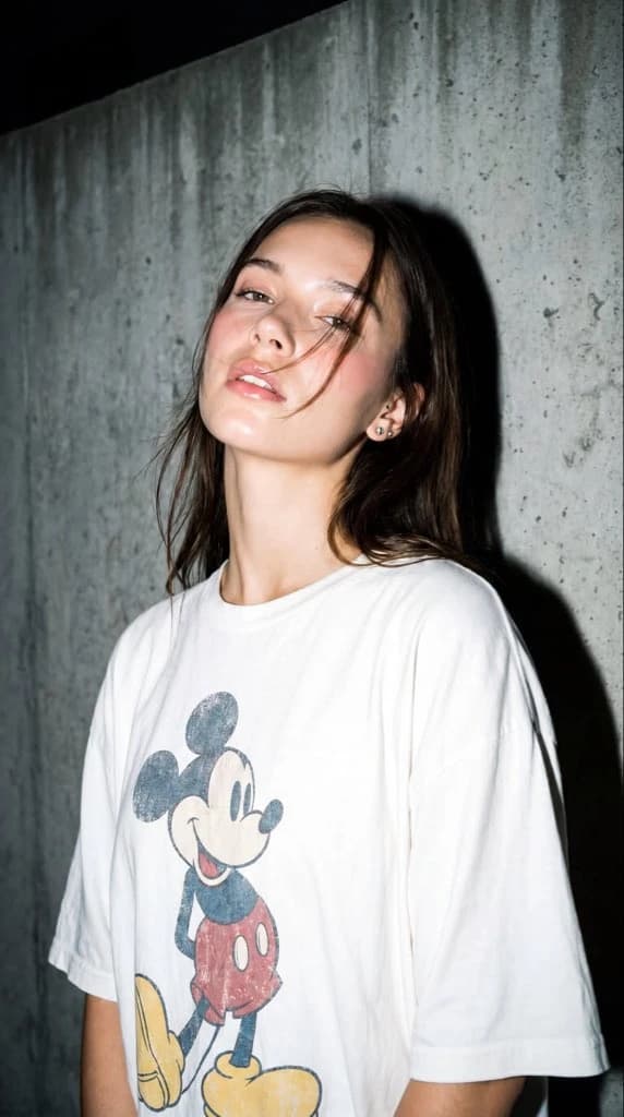 A high-resolution, close-up editorial-style portrait of a young woman sta...