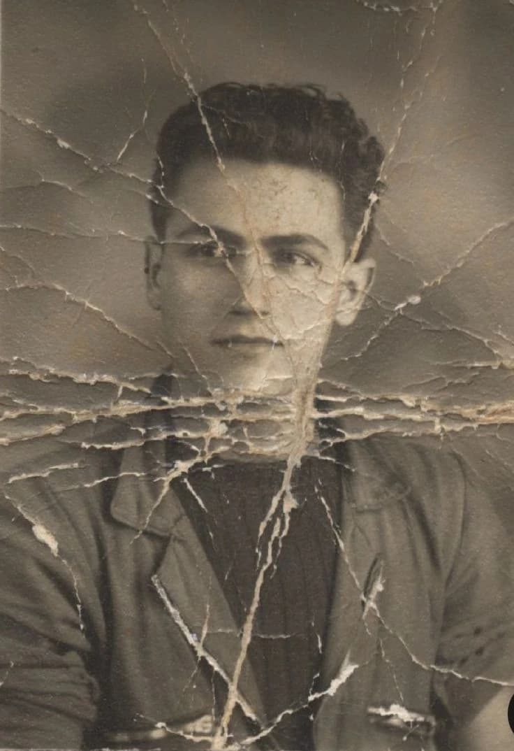 Restore the image while preserving the exact facial identity of the subje...