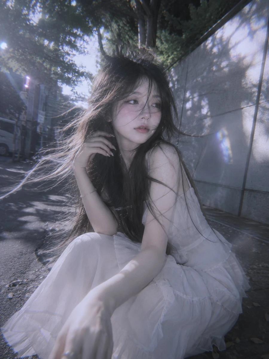 A surreal doll-like young woman with waist-length flowing hair, captured...