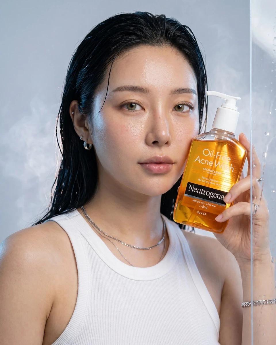 Ultra-realistic luxury skincare advertisement for Neutrogena Oil-Free Acn...