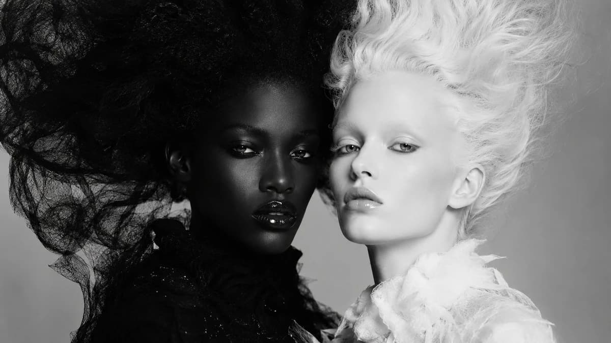 Core Concept: High fashion black and white editorial portrait of two wome...