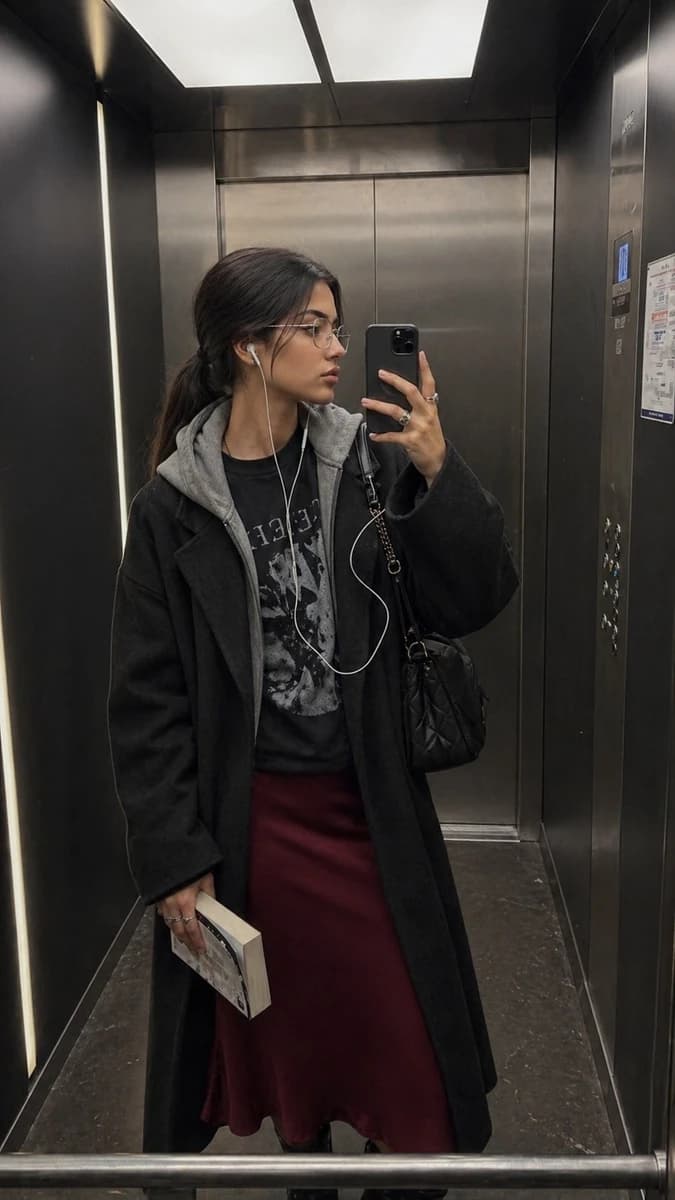 Ultra-realistic iPhone elevator mirror selfie, identity preserved exactly...